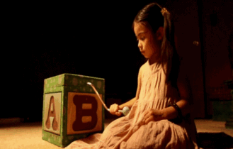 Child playing with clown lurking in the background